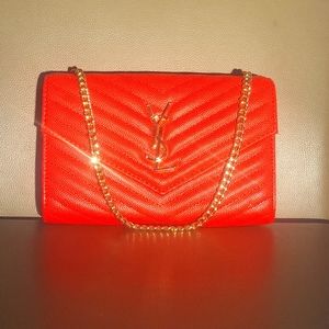 Yves Saint Laurent red leather bag with gold chain strap